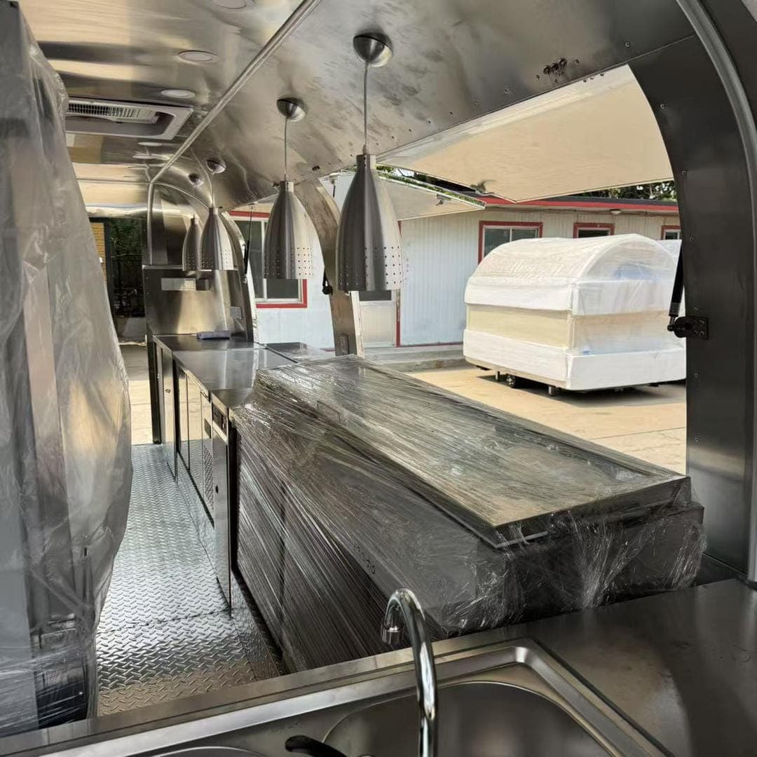 The service counter inside the trailer with pendant lights above